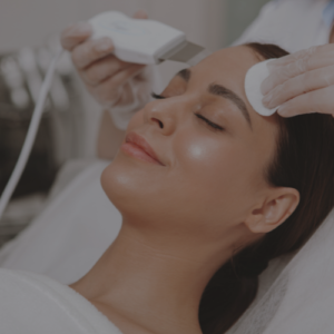 Zen Luxe Med Spa Aesthetic Services with Injector Resha A woman getting a facial treatment at a beauty salon.