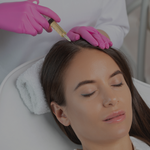 A woman getting a hair treatment AT Zen Luxe Med Spa Aesthetic Services with Injector Resha