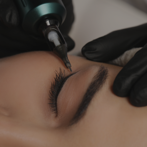 A woman is getting her eyebrows injected with a machine at Zen Luxe Med Spa Aesthetic Services with Injector Resha